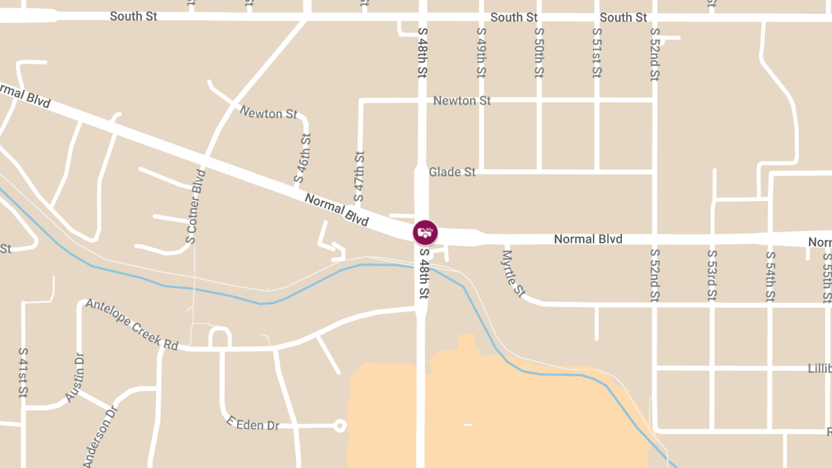 Car Crash into Building at 48th St and Normal Blvd causes Injury