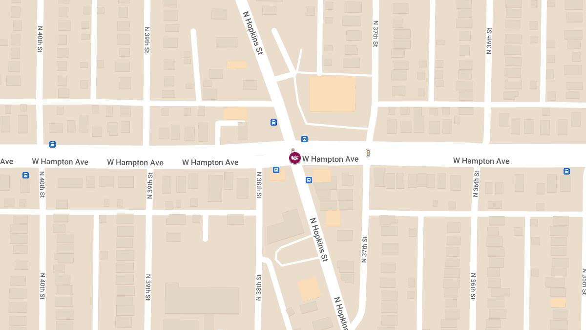 Injuries in Car Accident at Hopkins St & Hampton Ave Involving Building Collision