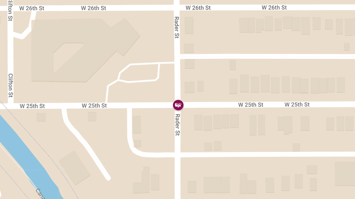 Car Crash With Injuries Involving Blue Sedan and SUV at W 25th St & Rader St