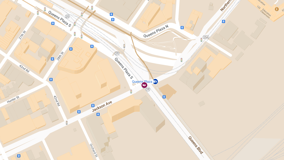 Injuries Reported in Collision Between Silver Cadillac and Black Ram at Queens Blvd & Jackson Ave