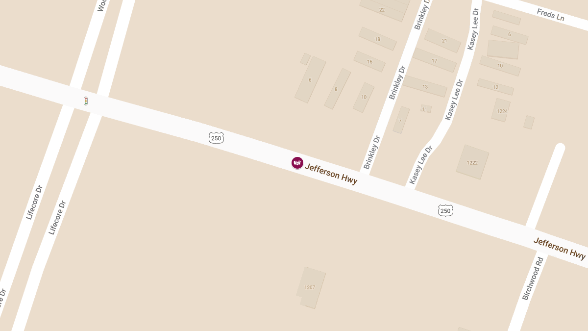 Vehicle Crashes into Building on Jefferson Hwy, Injuring Three
